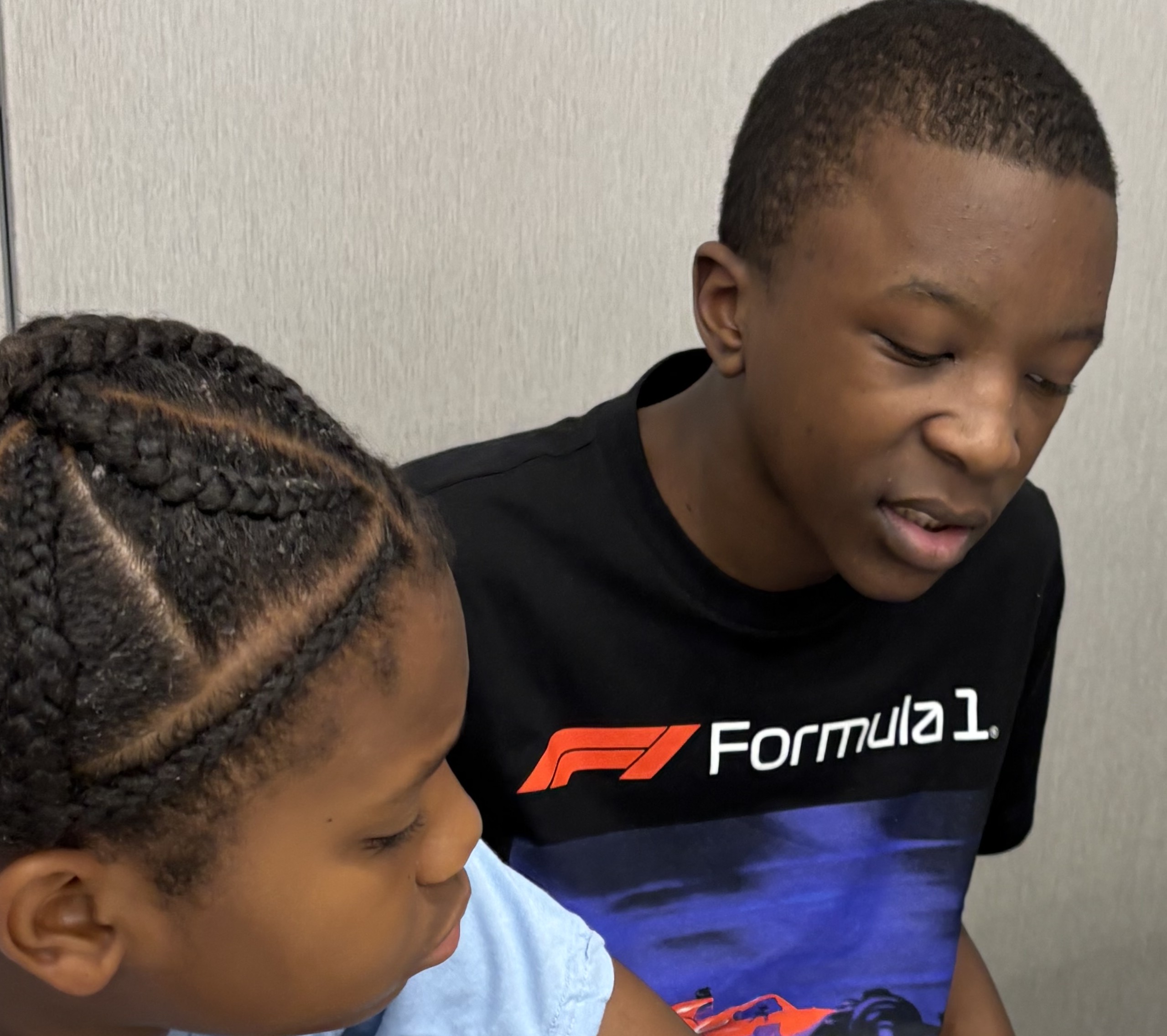 two students working together on laptop
